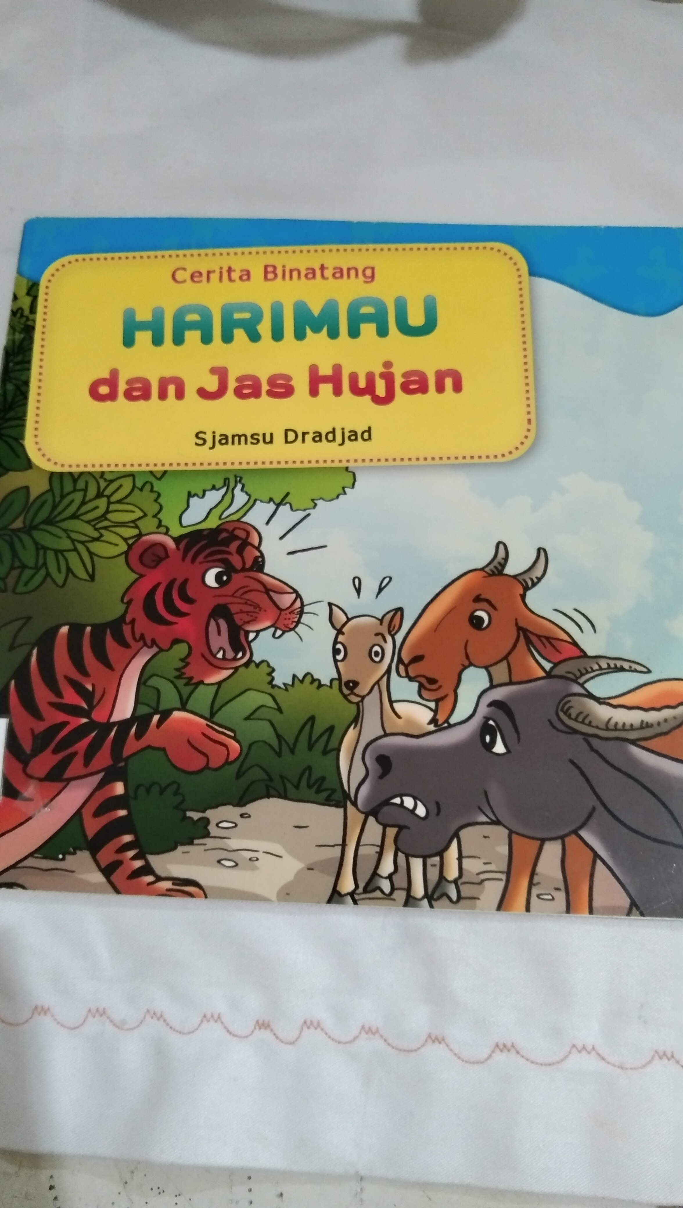 Harimau dan Jas Hujan