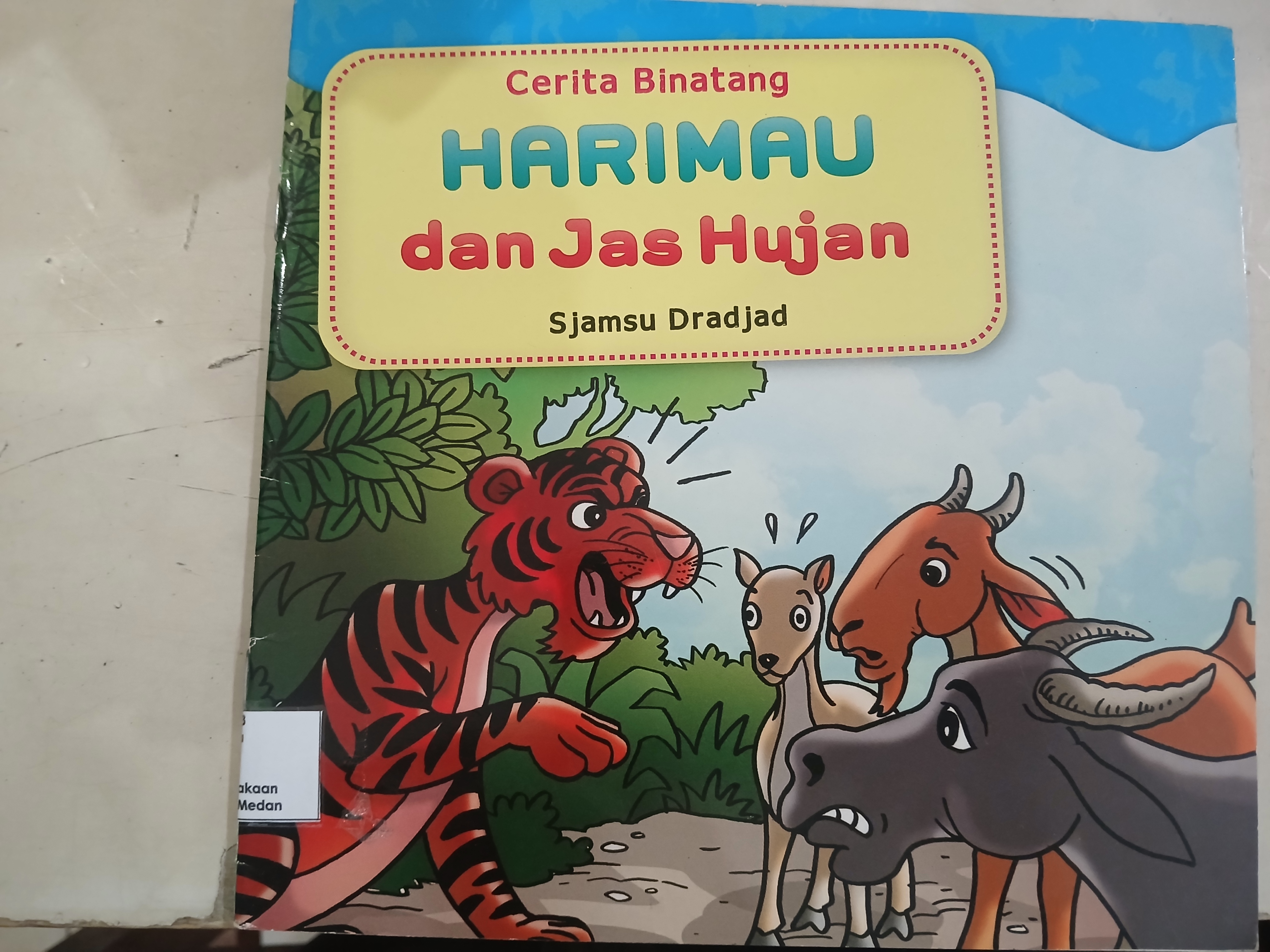 Harimau dan Jas Hujan